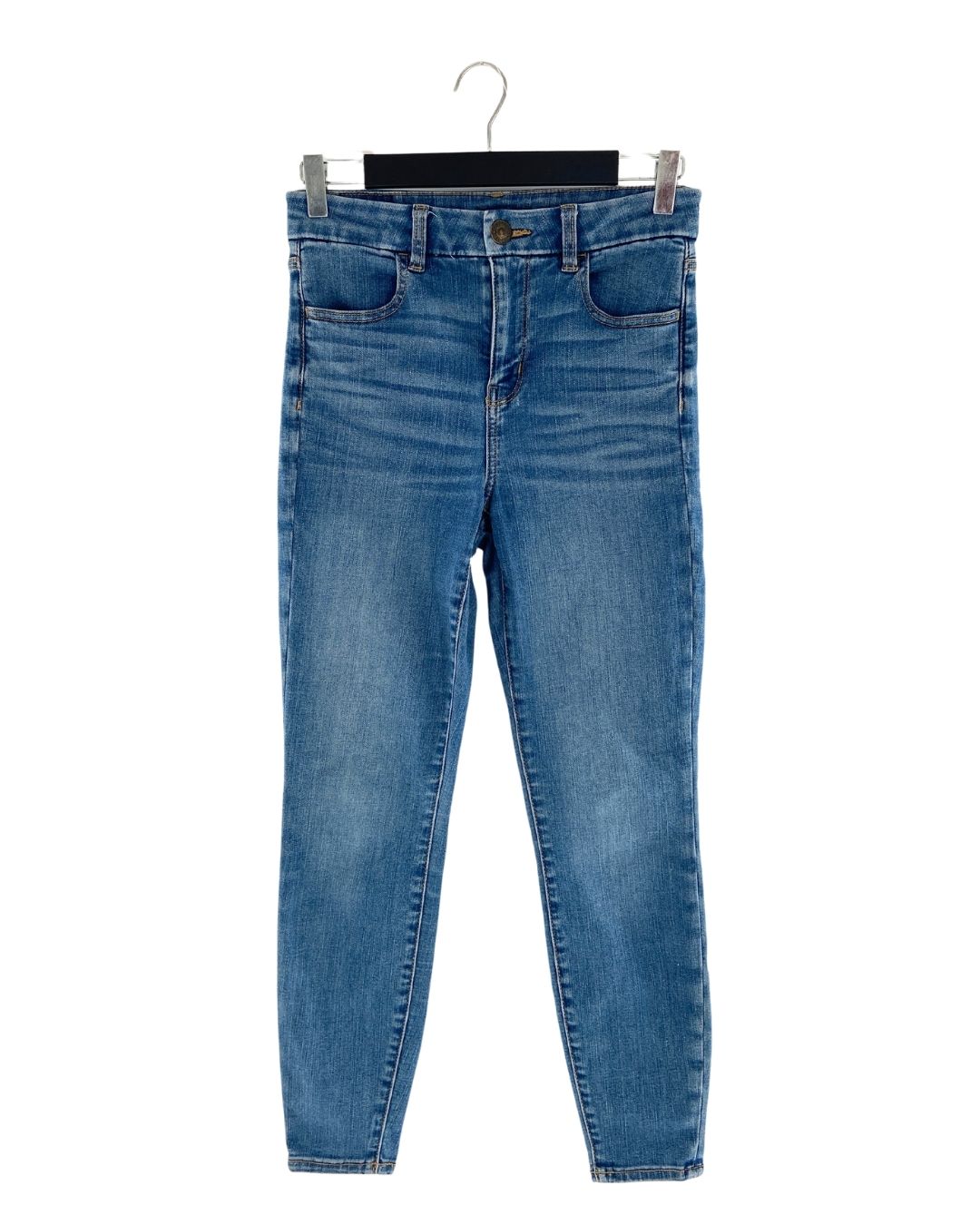 Jean skinny stretch tiro alto