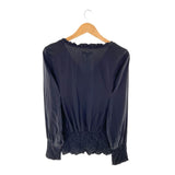 Blusa cuello V encauchada