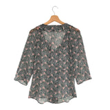 Blusa traslucida con vuelo